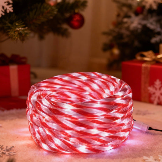 Candy cane-patterned LED rope light on a festive background with Christmas decorations.