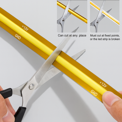 Scissors cutting a LED strip on a white background