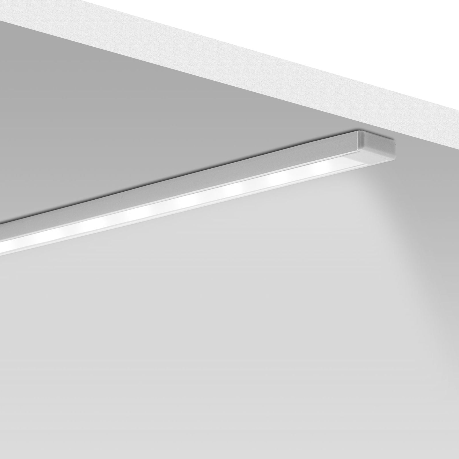 Linear LED light track on a white ceiling